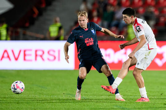 Oscar Lewicki of Malmö FF and Nikoloz Dadiani of FC Iberia