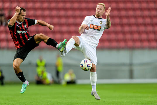 Martin Mikovic of Spartak Trnava and Mikkel Rygaard Jensen