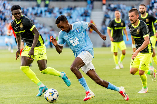 Rasid Njie and Roberts Savalnieks of FK RFS and Taha Ali of