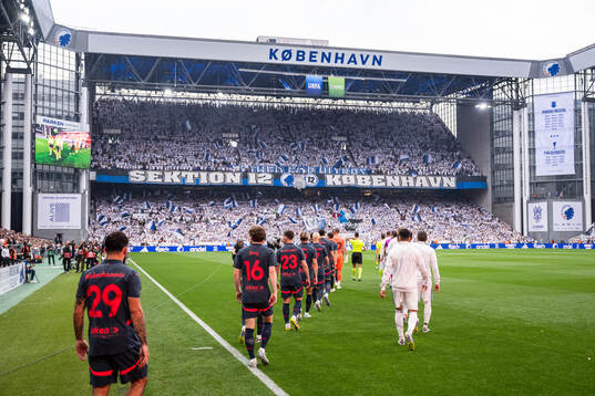 Players of Malmö FF and of FC Copenhagen enter the pitch