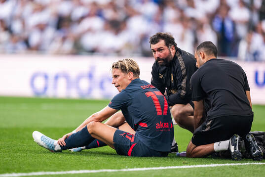 Jens Stryger Larsen of Malmö FF receives medical attention