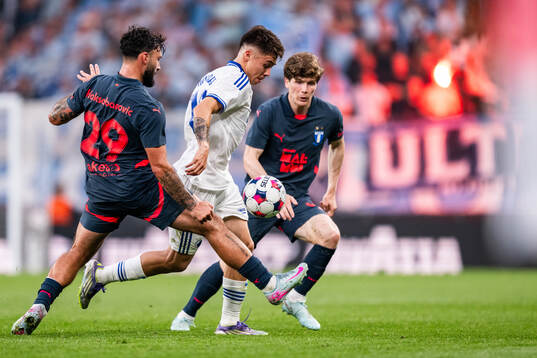 Sead Haksabanovic and Oliver Berg of Malmö FF compete for