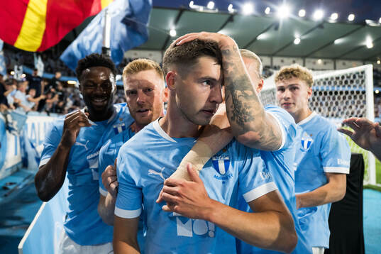 Lasse Berg Johnsen of Malmö FF celebrates with teammates