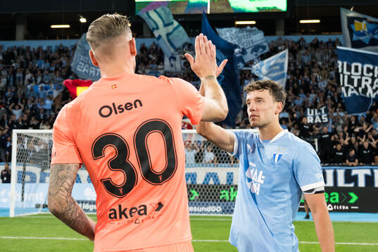 Robin Olsen and Colin Rösler of Malmö FF celebrate