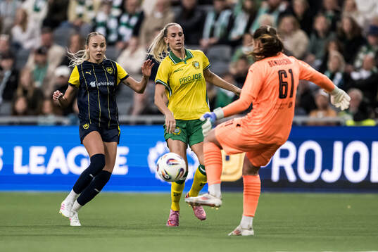 Yana Kotyk and goalkeeper Daryna Bondarchuk of Metalist