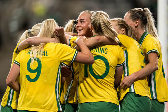 Cathinka Tandberg  of Hammarby celebrate with teammates