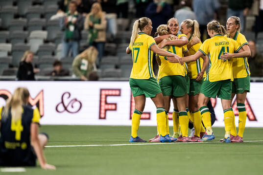 Cathinka Tandberg  of Hammarby celebrate with teammates