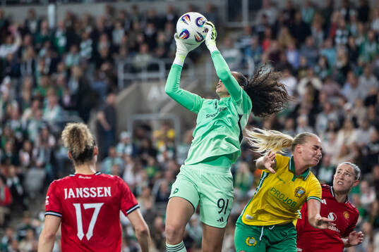 Goalkeeper Phallon Tullis-Joyce of Manchester United and