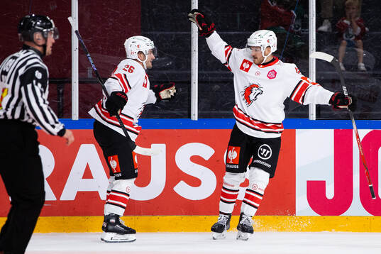 Yannick Zehnder of Lausanne celebrates with team mate Erik