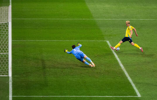 Lucas Bergvall of Sweden and goalkeeper Gregor Kobel of