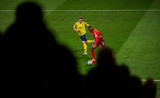 Viktor Gyökeres of Sweden and Manuel Akanji of Switzerland