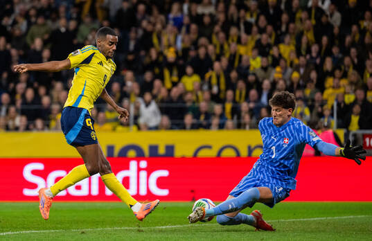 Alexander Isak of Sweden against goalkeeper Gregor Kobel of
