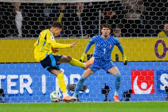 Goalkeeper Gregor Kobel of Switzerland and Yasin Ayari of