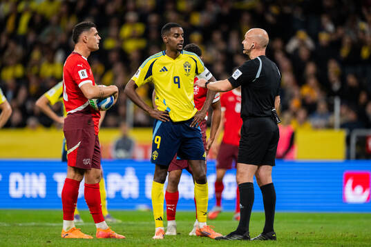 Granit Xhaka of Switzerland, Alexander Isak of Sweden and