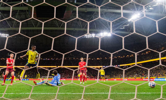 Alexander Isak of Sweden and goalkeeper Gregor Kobel of
