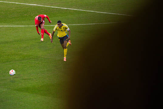 Manuel Akanji of Switzerland and Alexander Isak of Sweden
