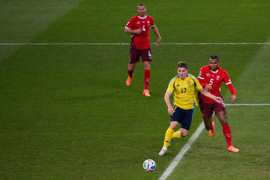 Nico Elvedi and Manuel Akanji of Switzerland against Viktor