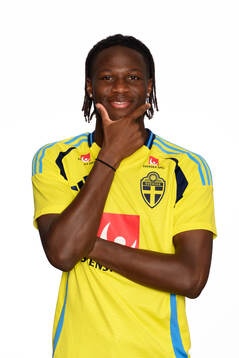 Alieu Njie poses for a portrait