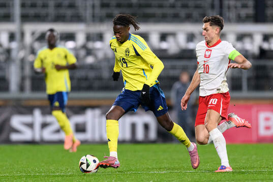Alieu Njie of Sweden and Tomasz Pienko of Poland