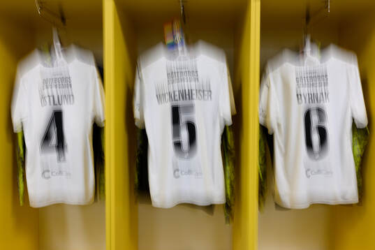 The jerseys of Emma Östlund, Mary Caroline Wickenheiser
