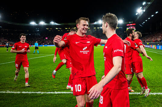 Jacob Ebsen Sørensen of Brann celebrates with Emil Kornvig