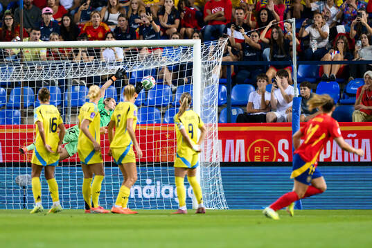 Alexia Putellas of Spain scores the 1-0 goal behind