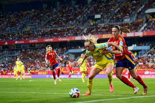 Stina Blackstenius of Sweden and Irene Paredes of Spain