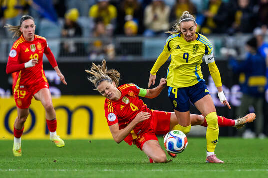 Irene Paredes of Spain and Kosovare Asllani of Sweden