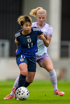 Mina Tanaka of Japan and Justine Kielland of Norway