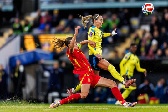 Irene Paredes of Spain and Kosovare Asllani of Sweden