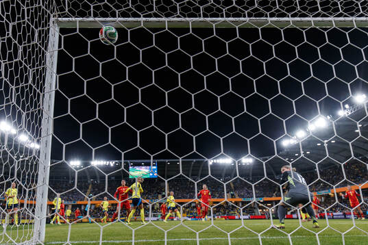Alexia Putellas of Spain scores 0-1 behind goalkeeper
