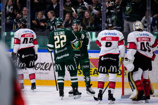 Färjestads Per Åslund och Joakim Nygård jublar