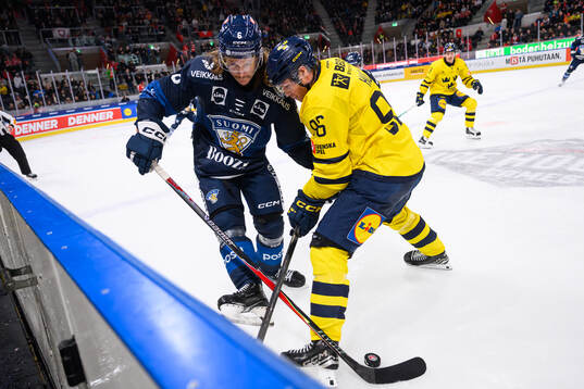 Sami Niku  of Finland and Rickard Hugg of Sweden in the ice