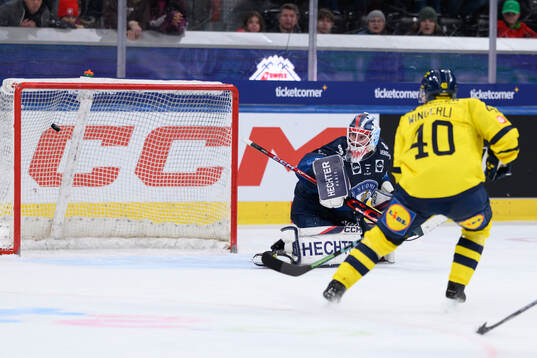 Lukas Bengtsson of Sweden scores the 1-2 goal in the ice