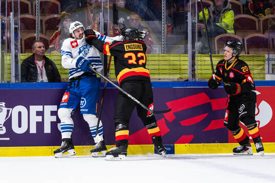 Daniel Voženilek of EV Zug, Oscar Engsund and Casper