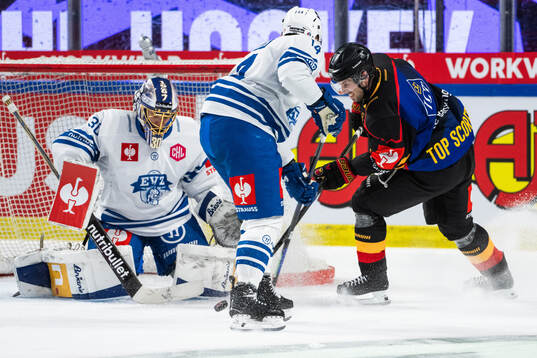 Goaltender Leonardo Genoni of EV Zug and Mathias Bromé of