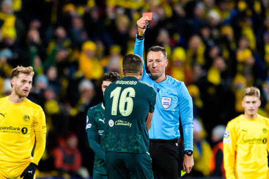 Rodri of Manchester City receives a red card