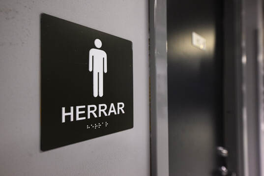 Skylt för herrtoalett