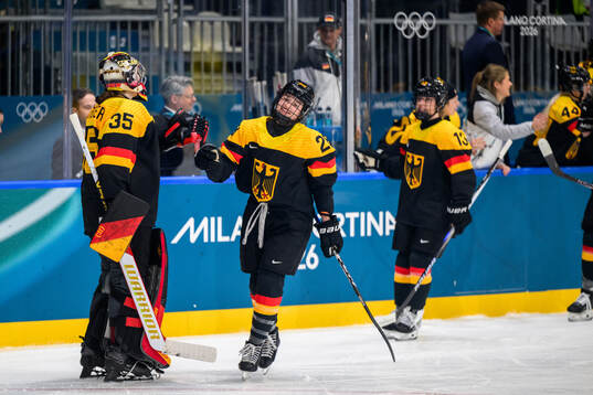 Katarina Jobst-Smith of Germany celebrates with goaltender