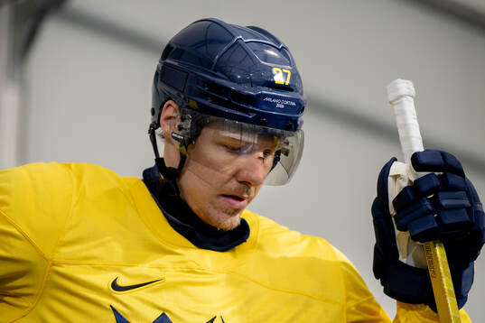 Hampus Lindholm of Sweden at an ice hockey practice session