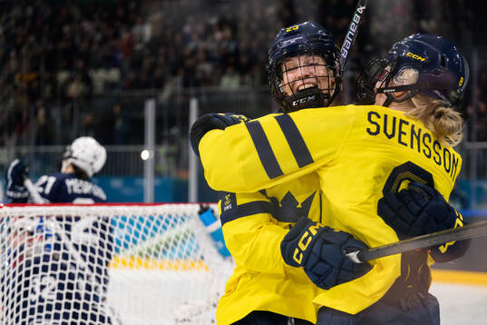 Thea Johansson and Hilda Svensson of Sweden celebrate the