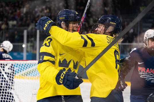 Thea Johansson and Hilda Svensson of Sweden celebrate the