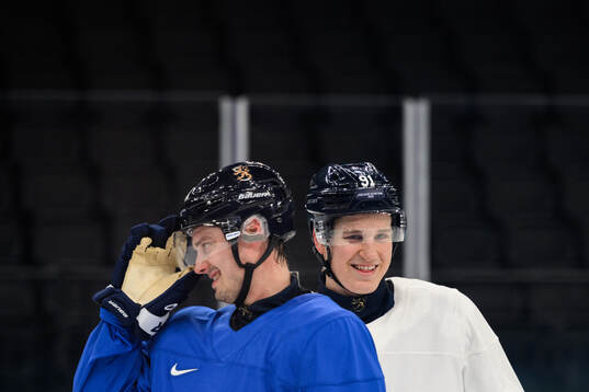 Sebastian Aho and Oliver Kapanen of Finland at an ice