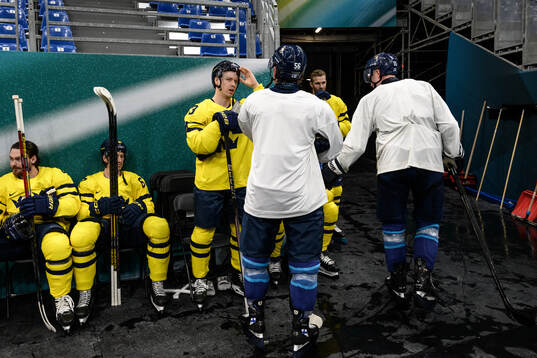 Jesper Bratt of Sweden with Erik Haula of Finland at an ice