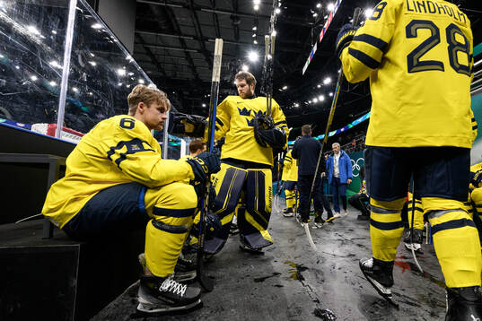 Philip Broberg and goaltender Filip Gustavsson of Sweden at