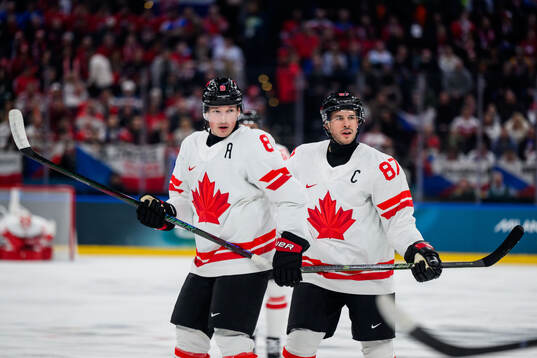 Cale Makar and Sidney Crosby of Canada in the men's ice