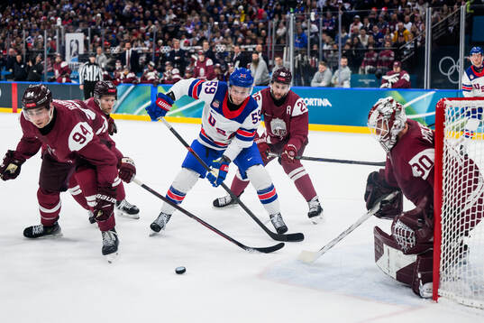Jake Guentzel of USA against Uvis Janis Balinskis and