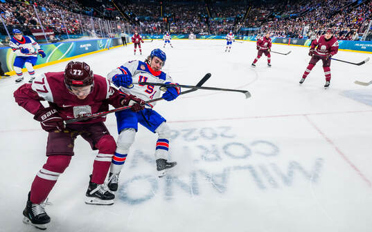 Kristaps Roberts Zile of Latvia against Quinn Hughes of USA