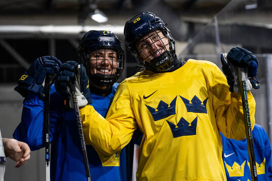 Anna Kjellbin and Hanna Olsson of Sweden at a ice hockey
