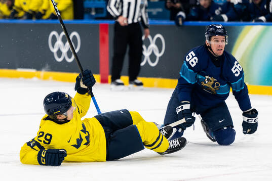 Pontus Holmberg of Sweden and Erik Haula of Finland in the